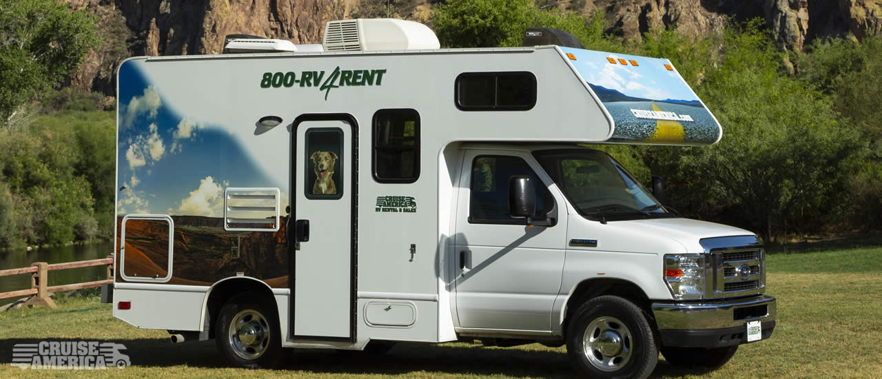 Front view of compact RV, showing side with door.
