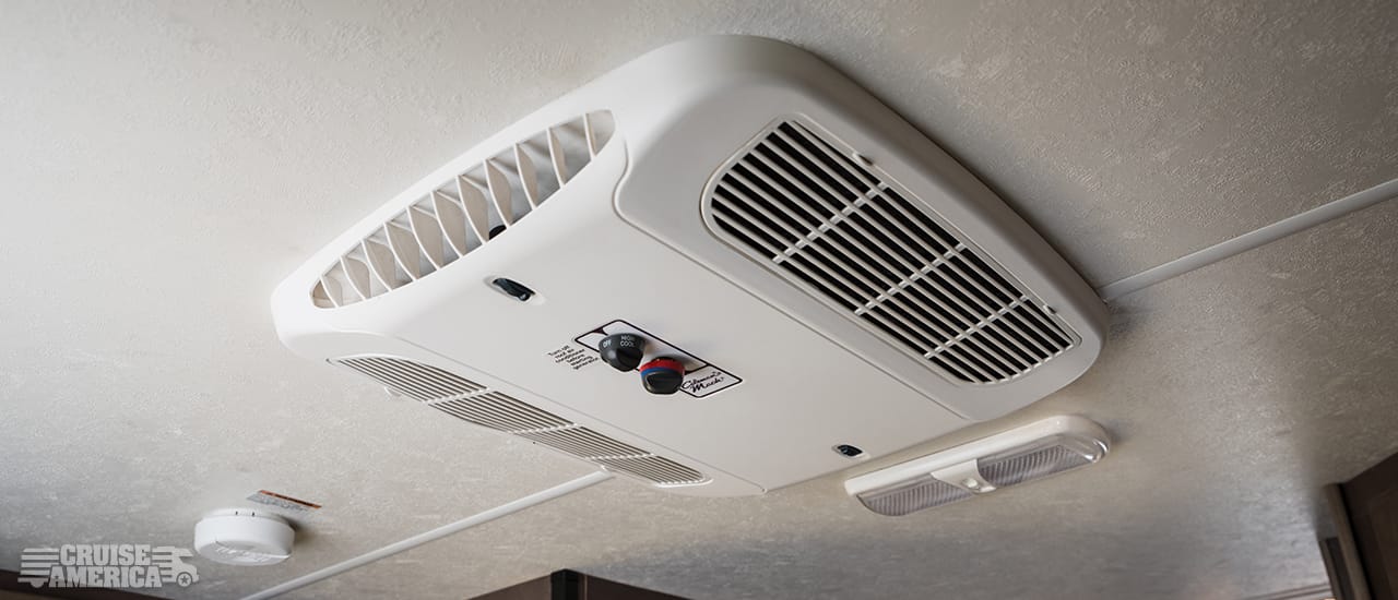 air conditioner vents and controls mounted on ceiling